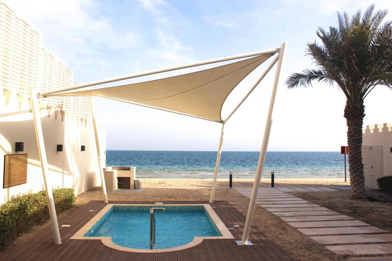 Sealine Beach, A Murwab Resort Mesaieed Exteriör bild A shade sail over a swimming pool